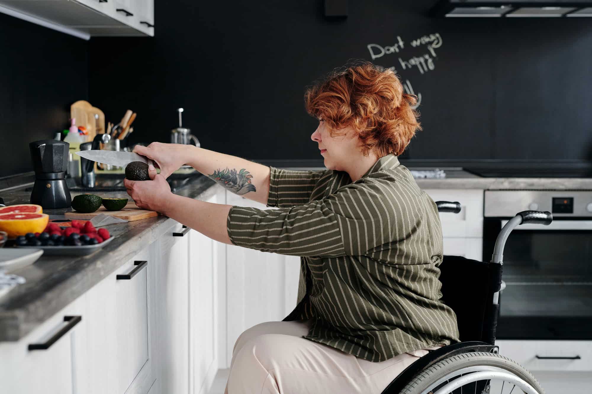 Self-Care woman in wheelchair cooking