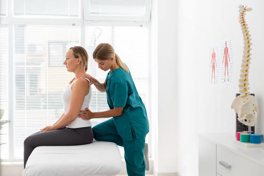 young-physiotherapist-helping-patient-with-back-problems-how-long-does-physical-therapy-last